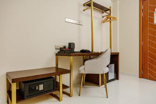 a desk and a chair in a room at Royal Villa Fulidhoo in Fulidu