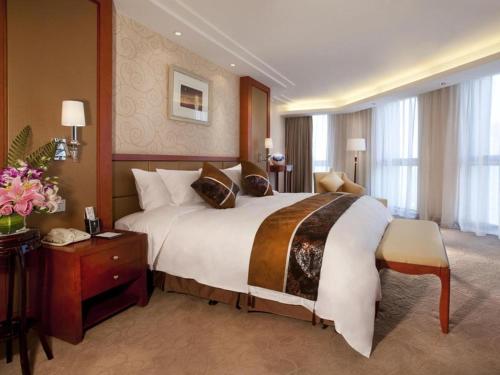 Postel nebo postele na pokoji v ubytování Xian Qujiang Yinzuo Hotel
