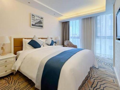 Postel nebo postele na pokoji v ubytování Xian Qujiang Yinzuo Hotel