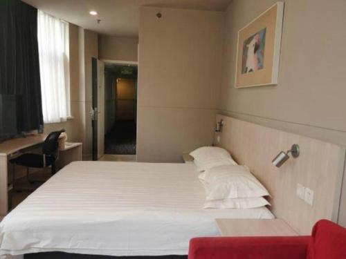 Postel nebo postele na pokoji v ubytování Jinjiang Inn Zhoushan Putuo Shenjiamen