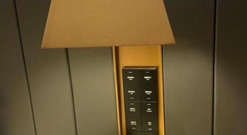a control panel of an elevator in an airplane at Movie Star Hotel in Guangzhou