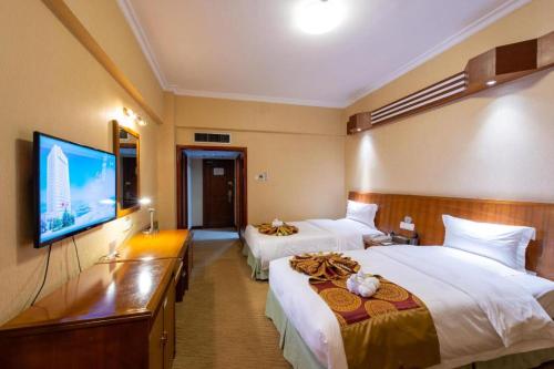 TV a/nebo společenská místnost v ubytování Yichang Three Gorges Project Hotel