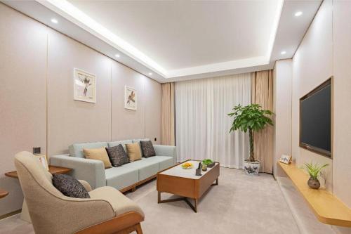 TV a/nebo společenská místnost v ubytování Yichang Three Gorges Project Hotel