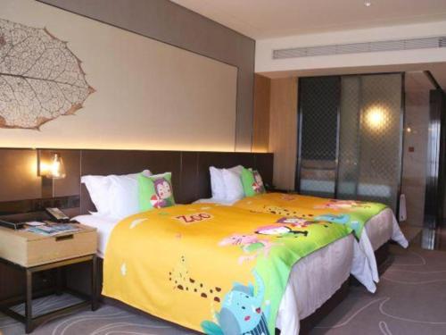 Ένα ή περισσότερα κρεβάτια σε δωμάτιο στο ZHONG DING HOTEL