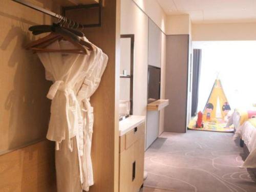 Ένα ή περισσότερα κρεβάτια σε δωμάτιο στο ZHONG DING HOTEL