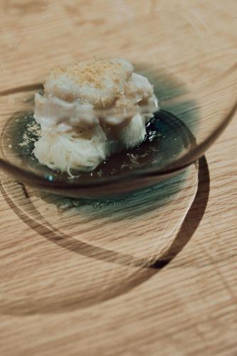 a plate of ice cream on a wooden table at Misenkan in Tenkawa