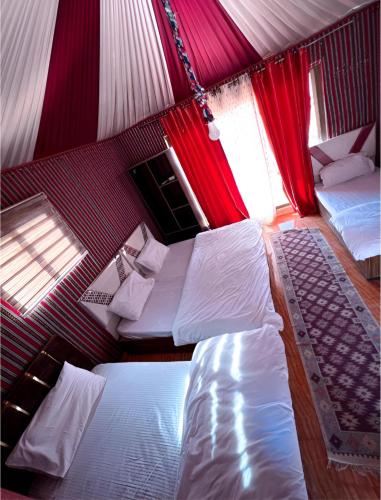 a bedroom with two beds in a tent at Star Wars luxury camp in Wadi Rum