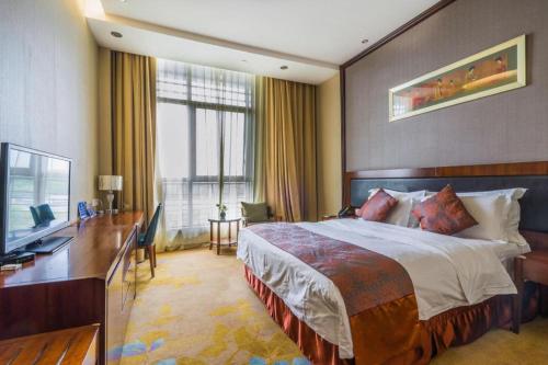 Voodi või voodid majutusasutuse Hangzhou Xixi Nade Runzeyuan Hotel toas