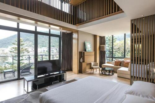 Postel nebo postele na pokoji v ubytování The Mulian Urban Resort Hotels Huadu