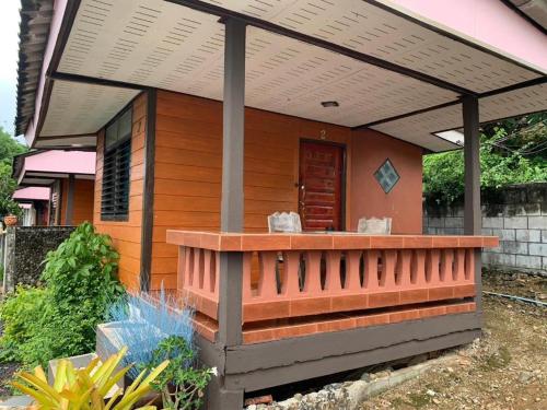a house with a pergola on top of it at Wanghin Bungalow in Surat Thani