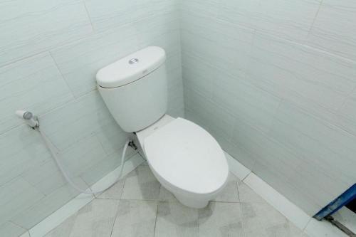 a bathroom with a white toilet in a room at Hostel Backpackers 44 in Yogyakarta