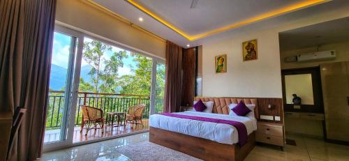 a bedroom with a bed and a balcony with a view at Evaara Resorts in Anachal