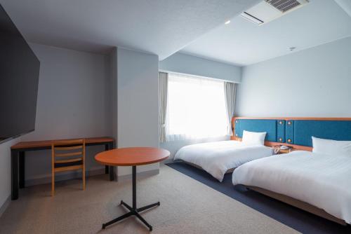 Postel nebo postele na pokoji v ubytování Hotel Global View Tsuchiura
