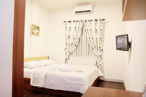 Katil atau katil-katil dalam bilik di Lotus Bandung Hotel, Cafe, and Meeting Place