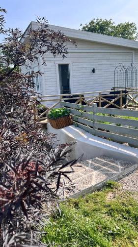 a hose is being used to water a house at Villa Vinja in Ystad