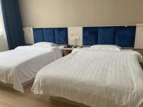 Katil atau katil-katil dalam bilik di 7 Days Inn Zhenjiang Jiangsu University