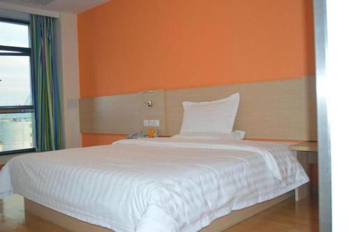 Ένα ή περισσότερα κρεβάτια σε δωμάτιο στο 7 Days Inn Shanghai Minhang Dongchuan Road Jiaotong University