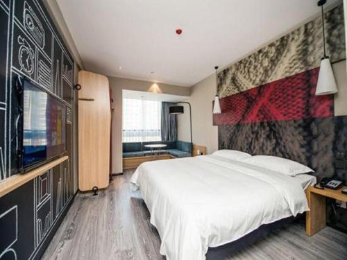 Postel nebo postele na pokoji v ubytování ibis Wuxi Jiangnan University