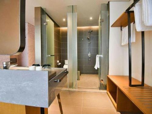 a bathroom with a shower and a sink at ibis xian North Second Ring Weiyang Rd Hotel in Xi'an