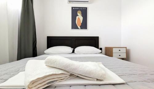 Ένα ή περισσότερα κρεβάτια σε δωμάτιο στο Cherry Apartment