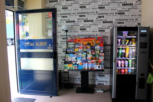a soda machine in a store next to a wall at Albert Hotel in Brussels