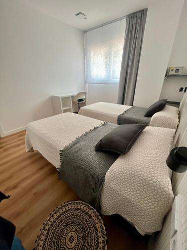 Katil atau katil-katil dalam bilik di Apartamento Xogo da Ola En el camino De Santiago