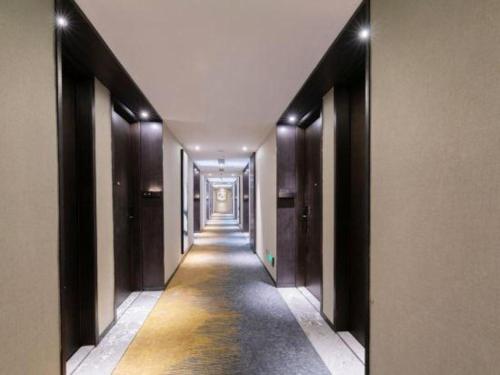 a hallway of a building with a long corridor at H Life Hotel Nanshan Branch in Shenzhen