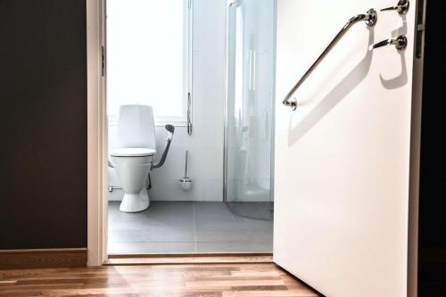 an open door to a bathroom with a toilet at Scandic Uplandia in Uppsala
