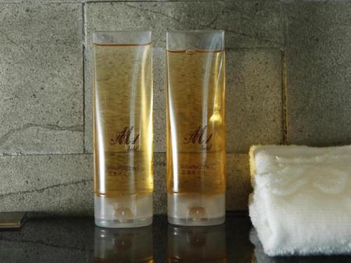 two glass vases sitting on top of a table at M1 North Point Hotel in Hong Kong