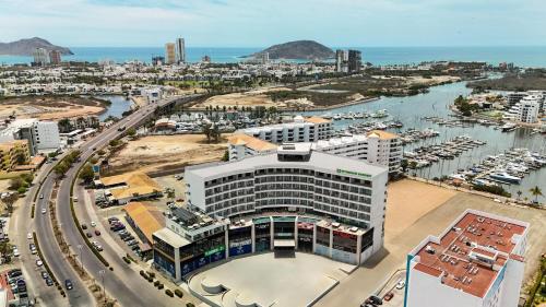 an aerial view of a building with a marina at Wyndham Garden Mazatlan Marina in Mazatlán