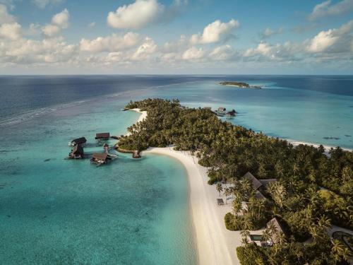 an aerial view of an island in the ocean at One&Only Reethi Rah in Reethi Rah