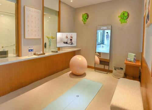 a room with a store with a yoga ball on the floor at Deacon House Wuxi in Wuxi