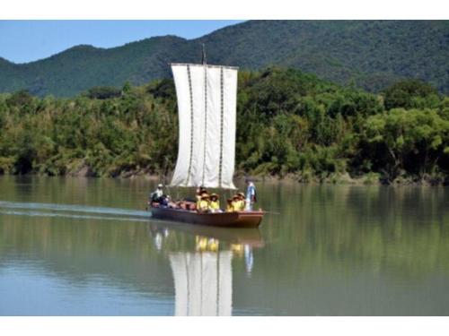 a group of people on a boat in the water at AKISAWA HOTEL in Shimanto
