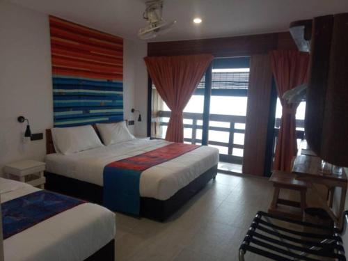 Postel nebo postele na pokoji v ubytování Beach Box Perhentian