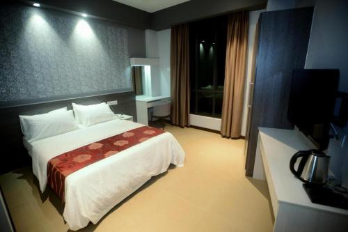 Postel nebo postele na pokoji v ubytování Star-Well hotel