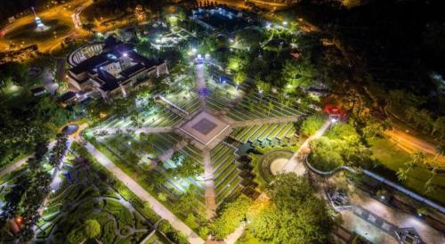 an overhead view of a park at night with lights at Hotel O 98inn in Miri