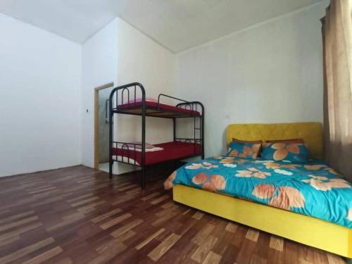 Ένα ή περισσότερα κρεβάτια σε δωμάτιο στο OYO 90799 Sharhan Residence