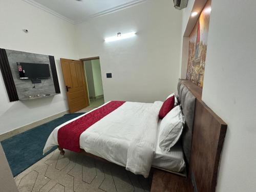 Letto o letti in una camera di Geetatri Luxury Homestay