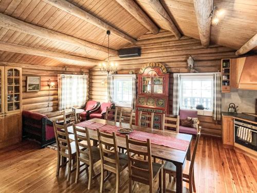 a dining room with a wooden table and chairs at 4 star holiday home in gol in Gol
