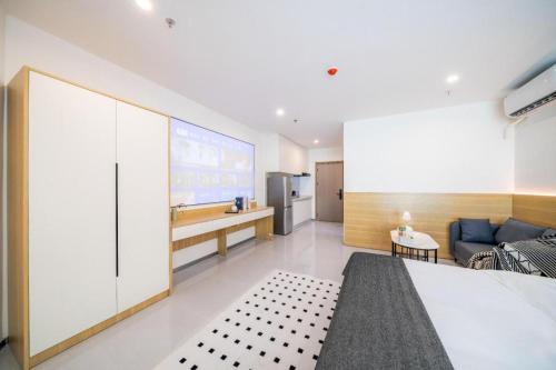 Katil atau katil-katil dalam bilik di Xicheng Administrative Apartment (Shenzhen North Station Longhua Yifangcheng Branch)