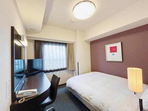 Телевизор и/или развлекательный центр в Hotel Route Inn Hirosaki Ekimae