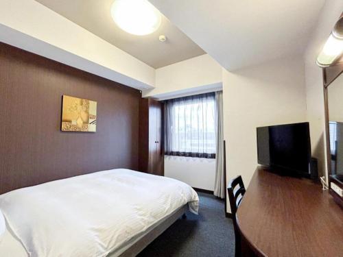 Телевизор и/или развлекательный центр в Hotel Route Inn Hirosaki Ekimae