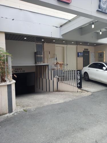 a car parked in front of a parking garage at 호텔 인썸니아 Hotel Insomnia 失眠酒店 in Daegu