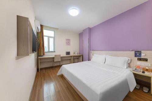 Katil atau katil-katil dalam bilik di 7 Days Inn Dongguan Changping Railway Station