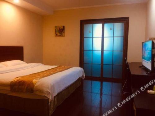 TV o dispositivi per l'intrattenimento presso GreenTree Inn Changshu South HaiYu Road Pedestrian Street Business Hotel