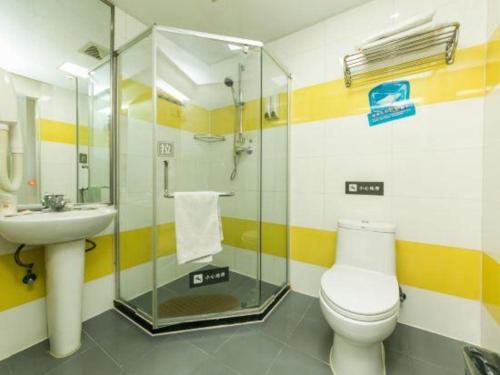 a bathroom with a toilet and a sink at 7 Days Inn Changchun Zhengyang Street Changchun Park Branch in Changchun