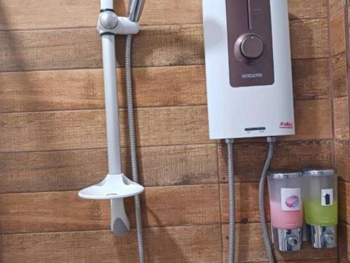 a cord hooked up to a speaker on a wall at CoZy House Chiangrai in Chiang Rai