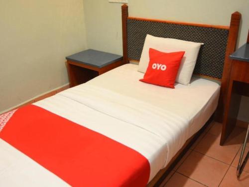 Кровать или кровати в номере OYO 89642 Highway Inn