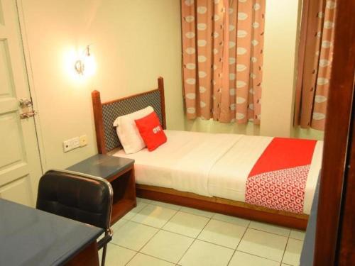 Кровать или кровати в номере OYO 89642 Highway Inn