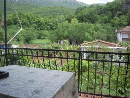 a balcony with a view of a garden at Lile Pestani Accommodation in Peštani